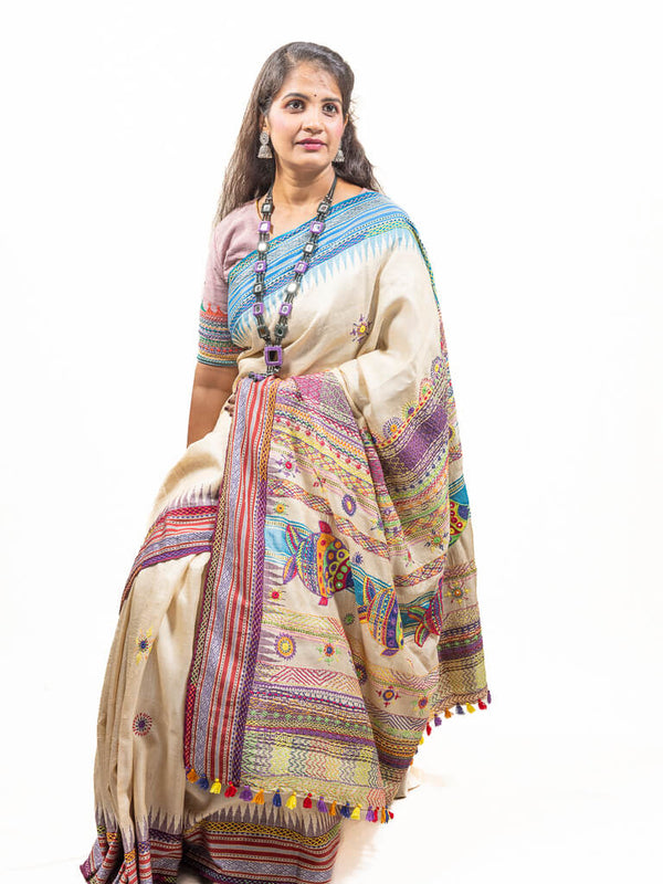 Handloom Beige with blue ganga jamuna border tussar silk saree with Sandur lambani embroidery