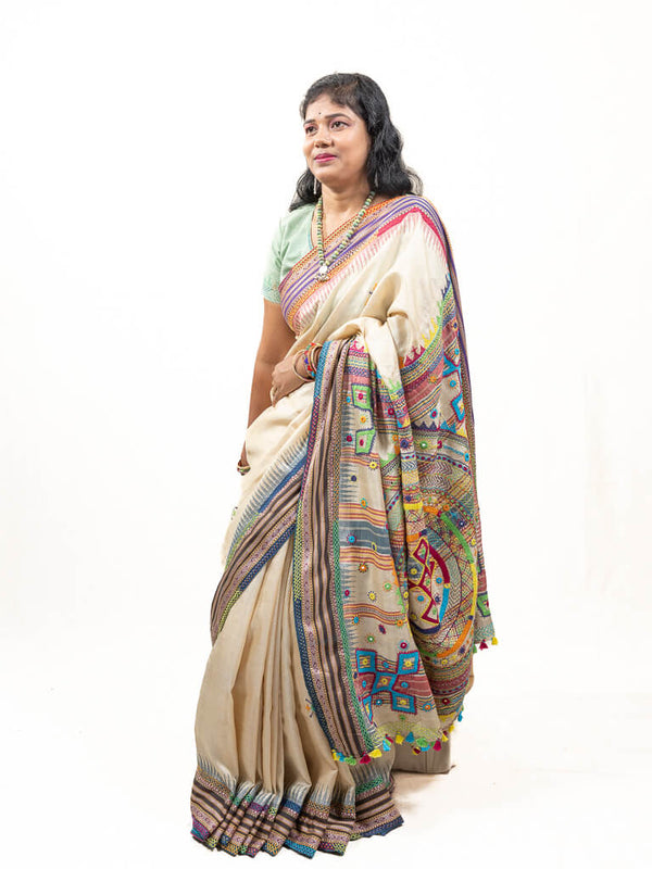 Handloom Beige with blue ganga jamuna border tussar silk saree with Sandur lambani embroidery
